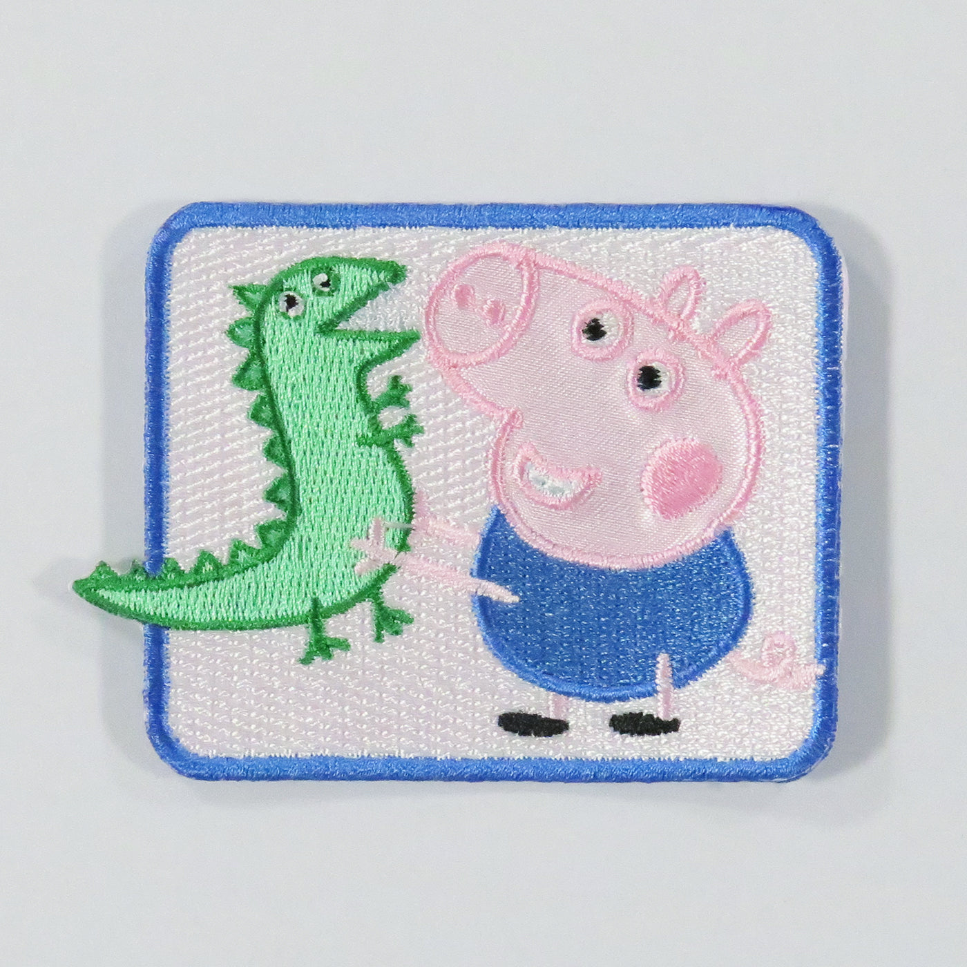 Brodert strykemerke av Georg fra den kjente serien Peppa Gris