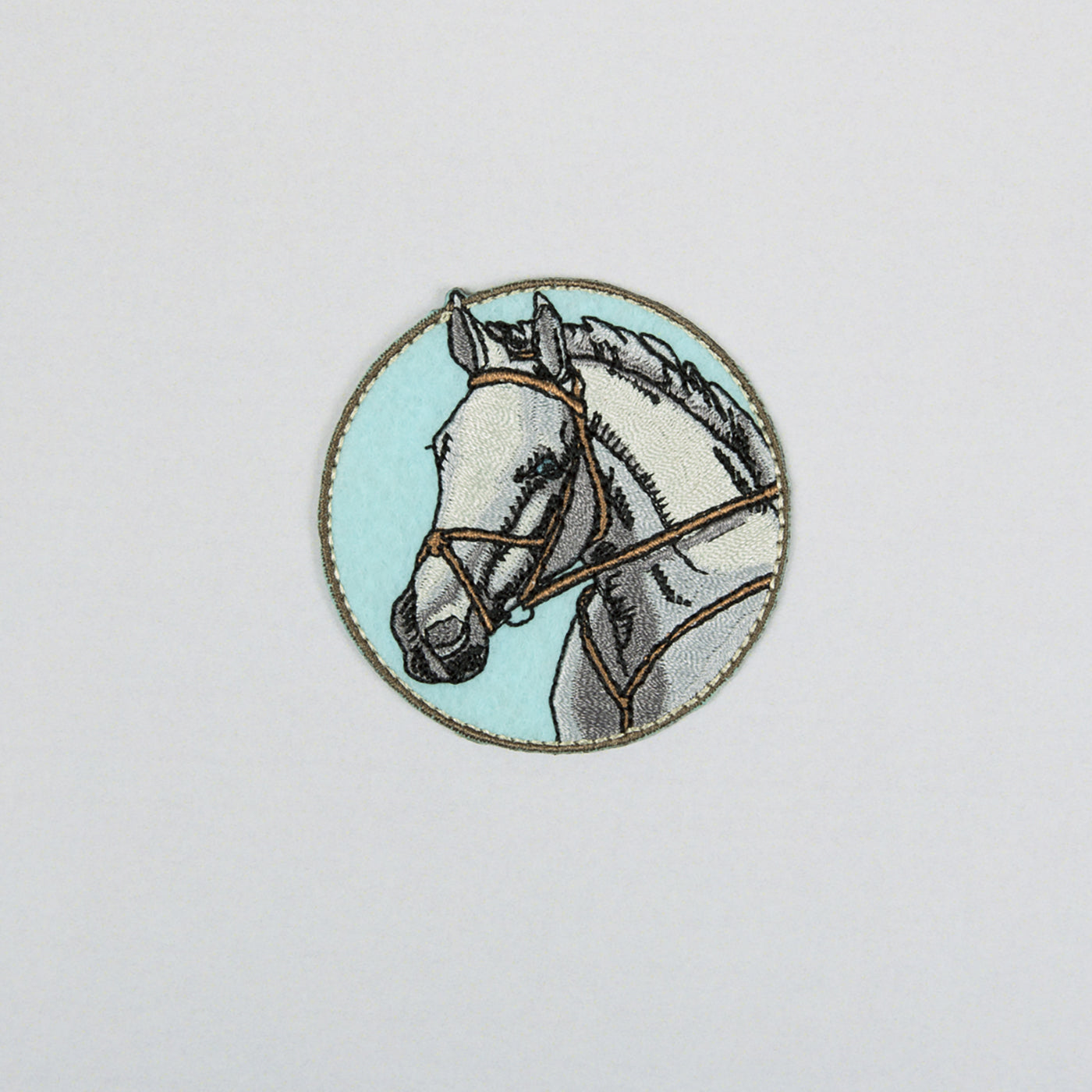 Brodert strykemerke med hestemotiv