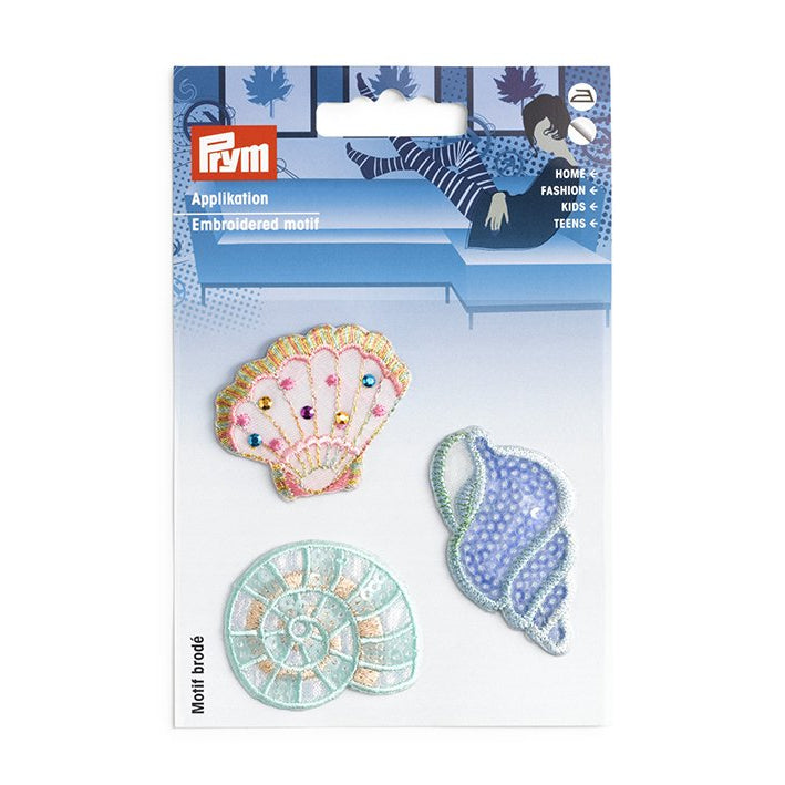 Broderte strykemerker med tre skjell i pakken