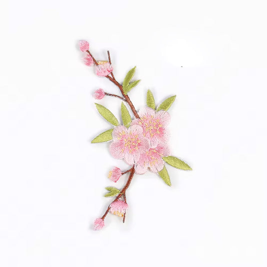 Brodert strykemerke av en blomsterlenke