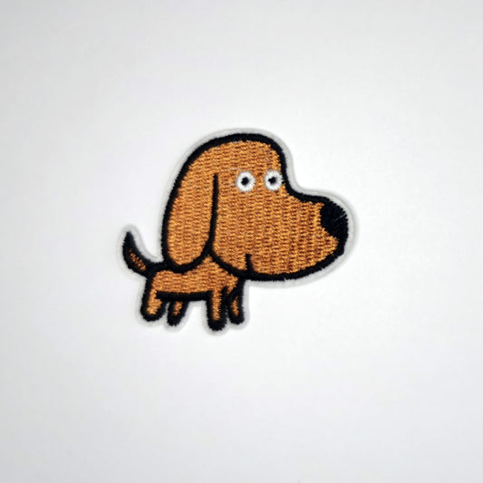 Brodert strykemerke med brun hund