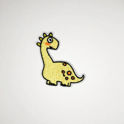 Strykelapp med motiv av Gul Dino