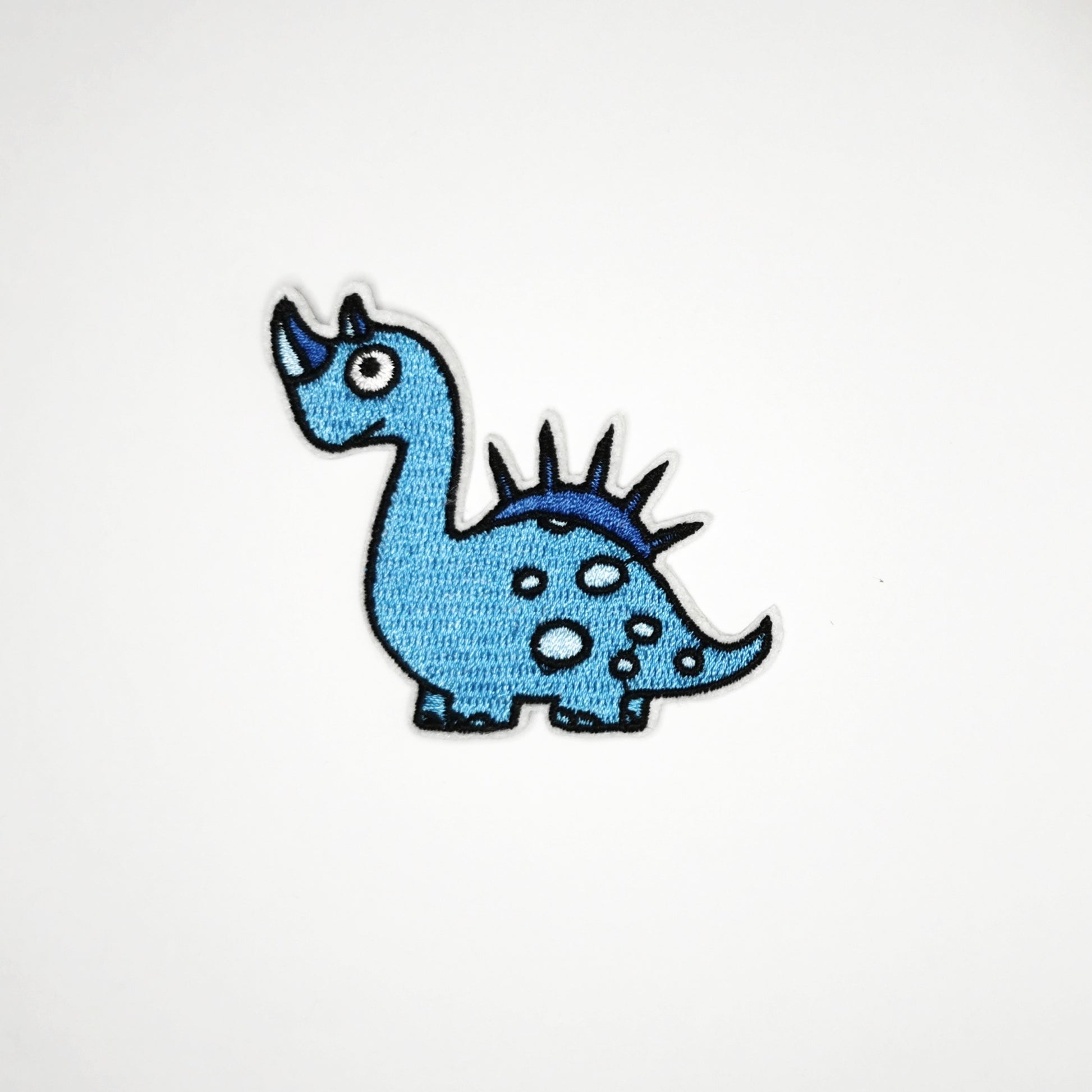 Strykelapp med motiv av Horn Dino