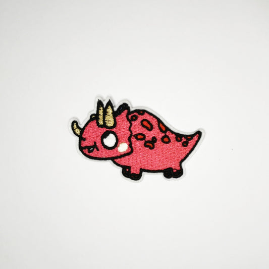 Strykelapp med motiv av Kikkende Dino