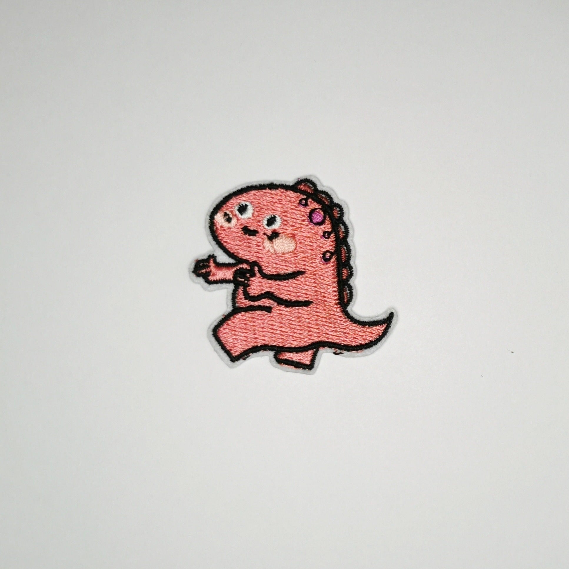 Strykelapp med motiv av Pekende Dino