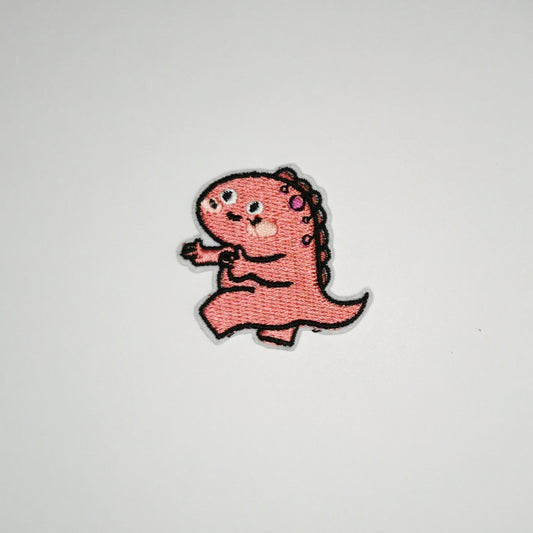 Strykelapp med motiv av Pekende Dino