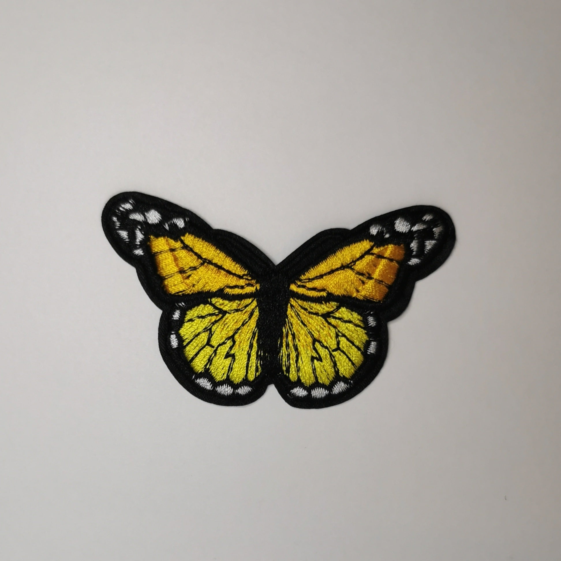 Brodert strykemerke, gul, lime og hvit sommerfugl