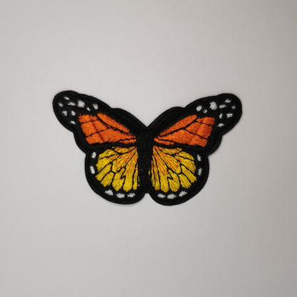 Brodert strykemerke, orange sommerfugl