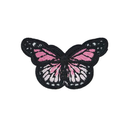 Brodert strykemerke, rosa og hvit sommerfugl