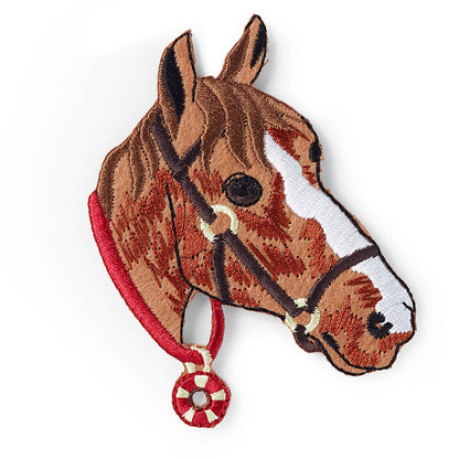 Brodert strykemerke av hestehode med medalje rundt halsen